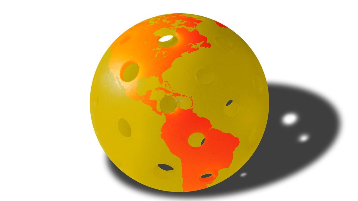 yellow pickleball with orange outlines of continents
